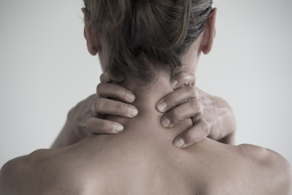 closeup-shot-of-a-female-having-a-neck-pain.jpg